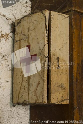 Image of Old first aid kit among the cobwebs