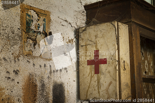 Image of Old first aid kit among the cobwebs