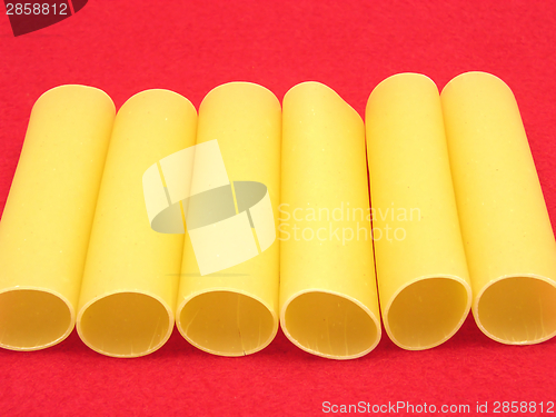 Image of A close-up view on several canneloni on red felt