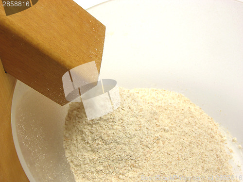 Image of Flour mill on its work grounding meal