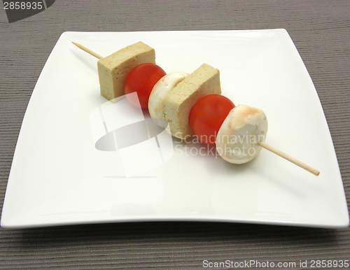 Image of Vegetable spit with bean curd and rice on white plate