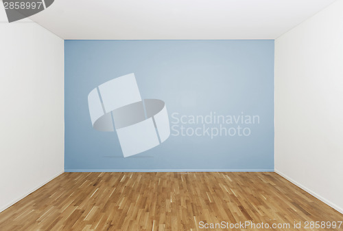 Image of Empty room with a blue wall
