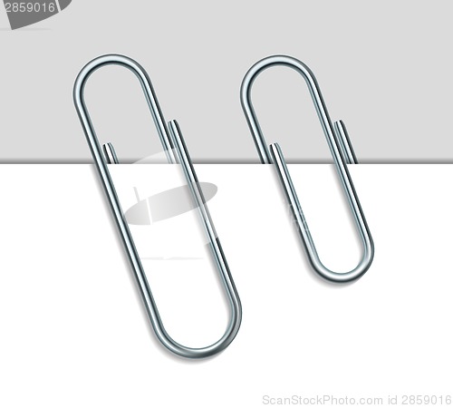 Image of Metal paperclip and paper