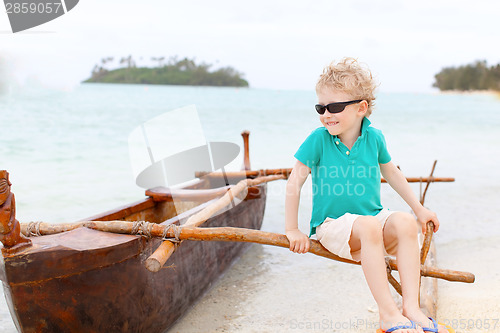 Image of kid at outrigger canoe