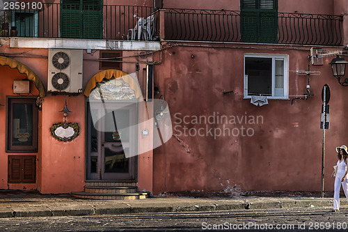 Image of White dressed lady at the sunset in Ischia