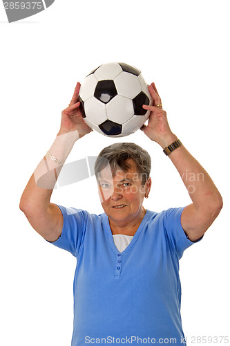 Image of Senior woman throwing a ball