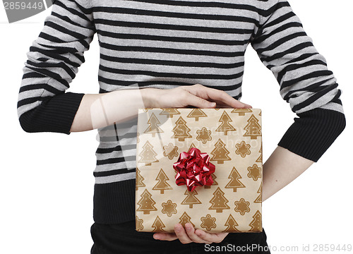 Image of Young woman holding a present