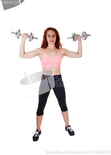Image of Exercising with dumbbell's.