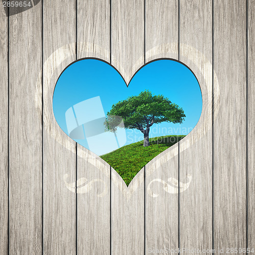 Image of wooden heart with a tree