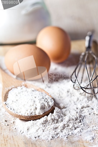 Image of flour, eggs and kitchen utensil 