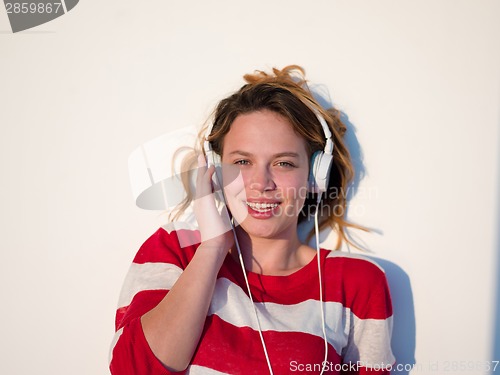 Image of relaxed young woman at home working on laptop