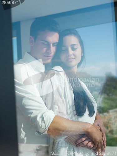 Image of relaxed young couple at home