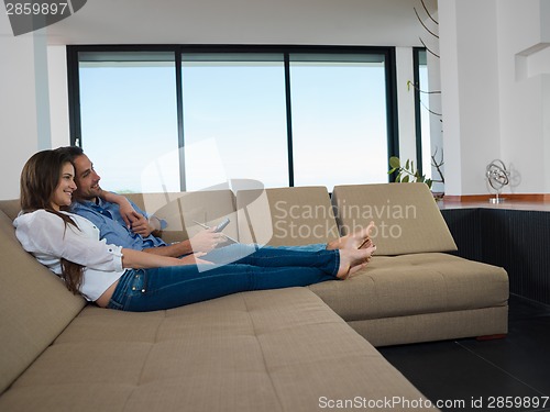 Image of relaxed young couple at home