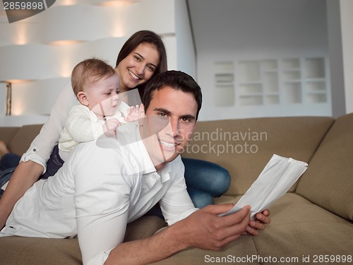 Image of happy young family at home