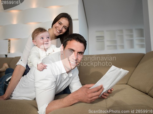 Image of happy young family at home