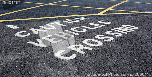 Image of Caution vehicles crossing - warning in car park