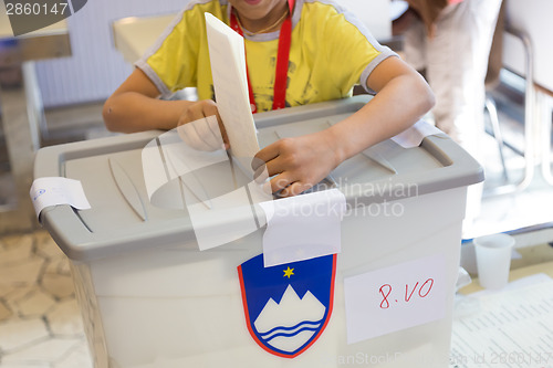 Image of Boy voting on democratic election.