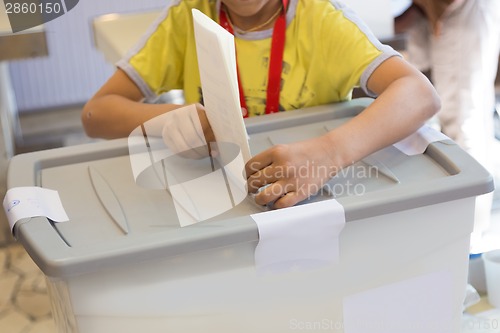 Image of Boy voting on democratic election.