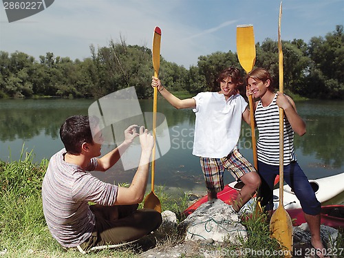 Image of friends having fun at sunday near river