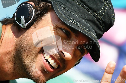 Image of man listening to music in headphones