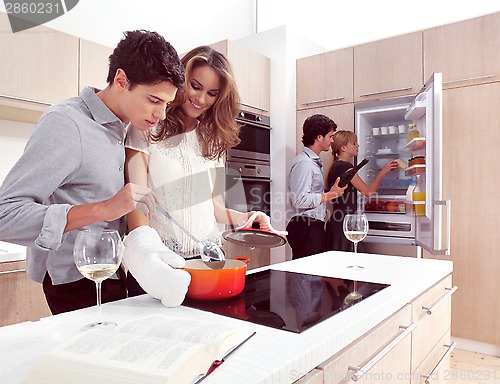 Image of young friends preparing pasta