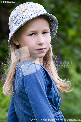 Image of little girl in blue hat