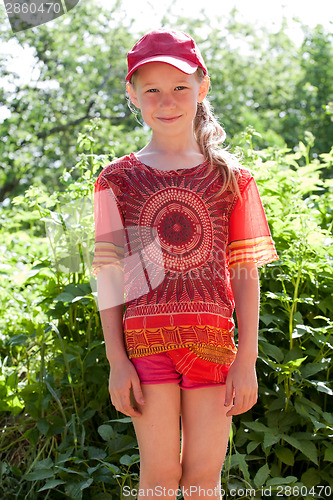 Image of little girl in red cap