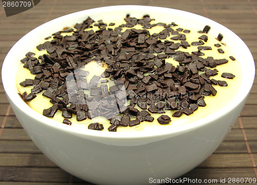 Image of Custard with grated chocolate in a bowl of china ware