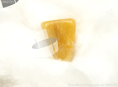 Image of Orange calcite mineral on cotton