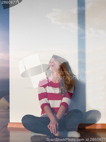 Image of relaxed young womant at home