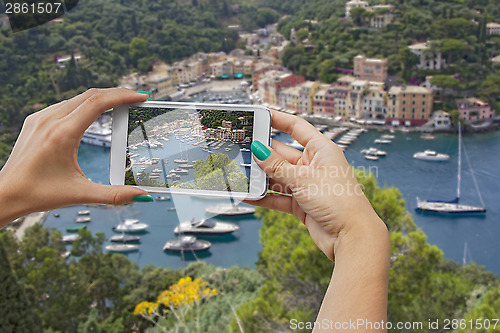 Image of Portofino photographing with mobile phone