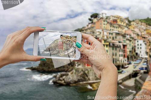 Image of Riomaggiore photographing with mobile phone