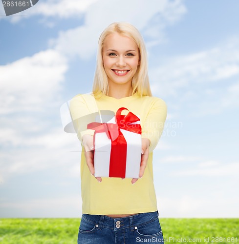 Image of smiling girl with gift box