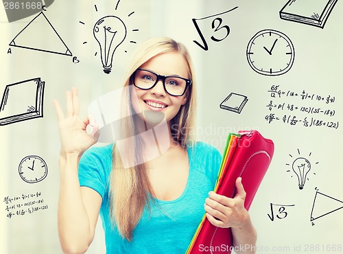 Image of smiling student with folders