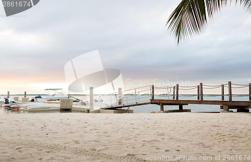 Image of boats moored to pier