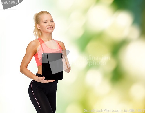 Image of smiling woman showing tablet pc blank screen