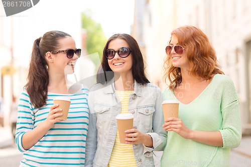 Image of smiling teenage girls with on street