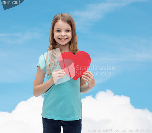 Image of smiling little girl with red heart