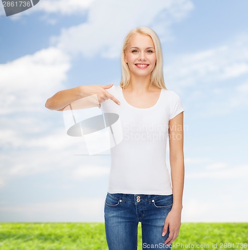 Image of smiling young woman in blank white t-shirt