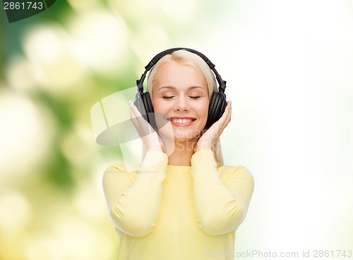 Image of smiling young woman with headphones