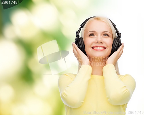 Image of smiling young woman with headphones