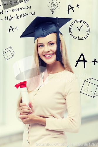 Image of student in graduation cap with certificate