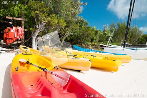 Image of canoes on sandy beach