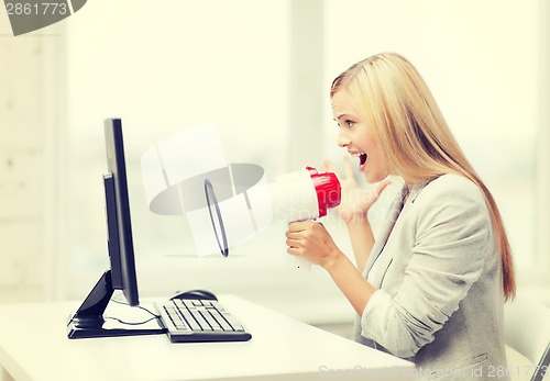 Image of strict businesswoman shouting in megaphone