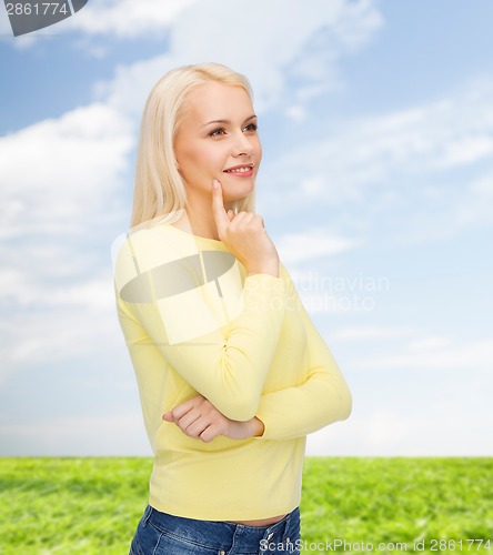 Image of happy smiling woman dreaming