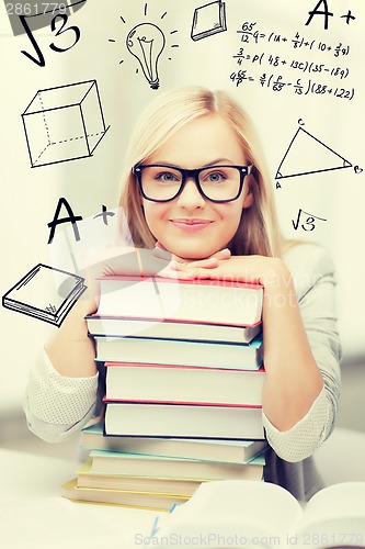 Image of student with stack of books and doodles