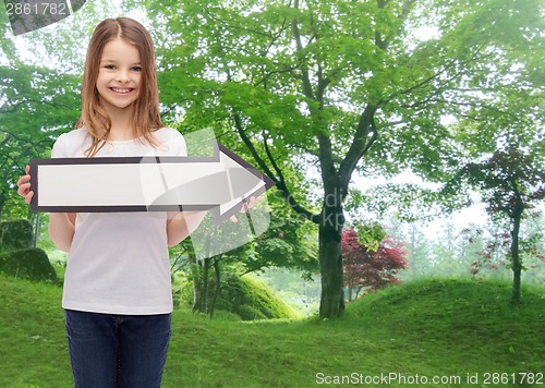 Image of smiling girl with blank arrow pointing right