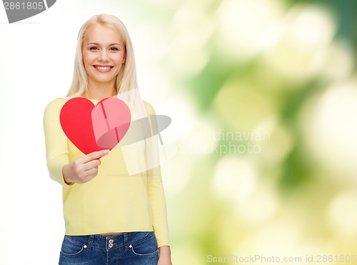 Image of smiling woman with red heart