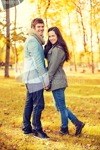 Image of romantic couple in the autumn park
