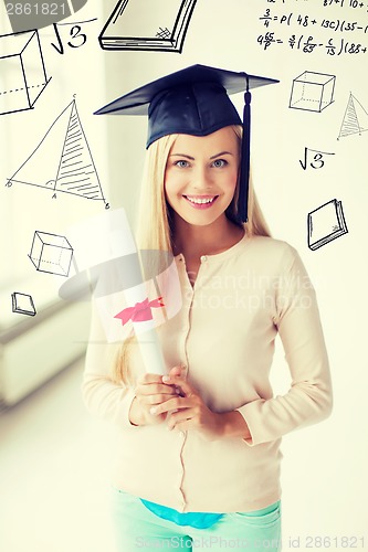 Image of student in graduation cap with certificate